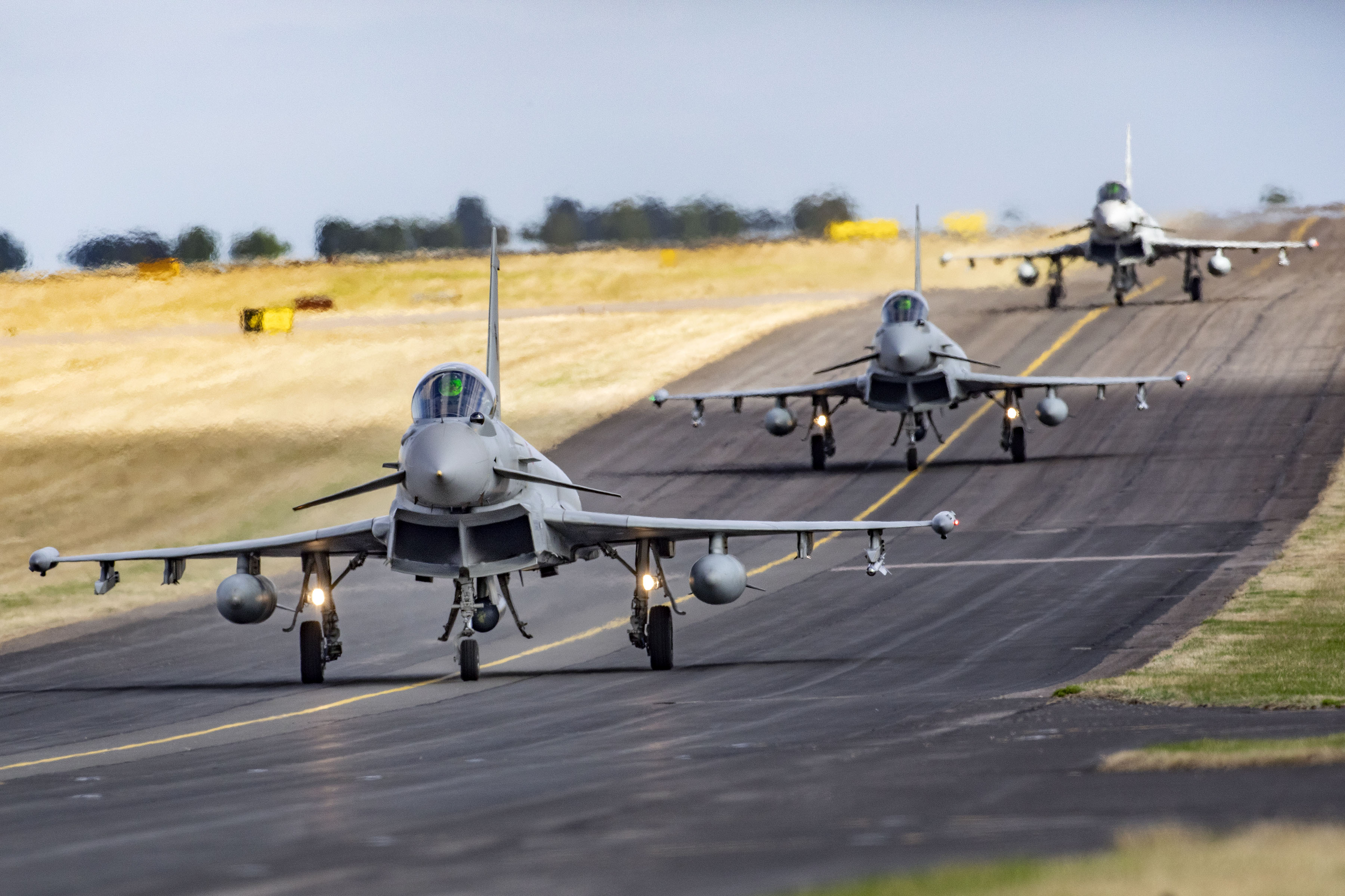 Image shows three aircraft on the runway.